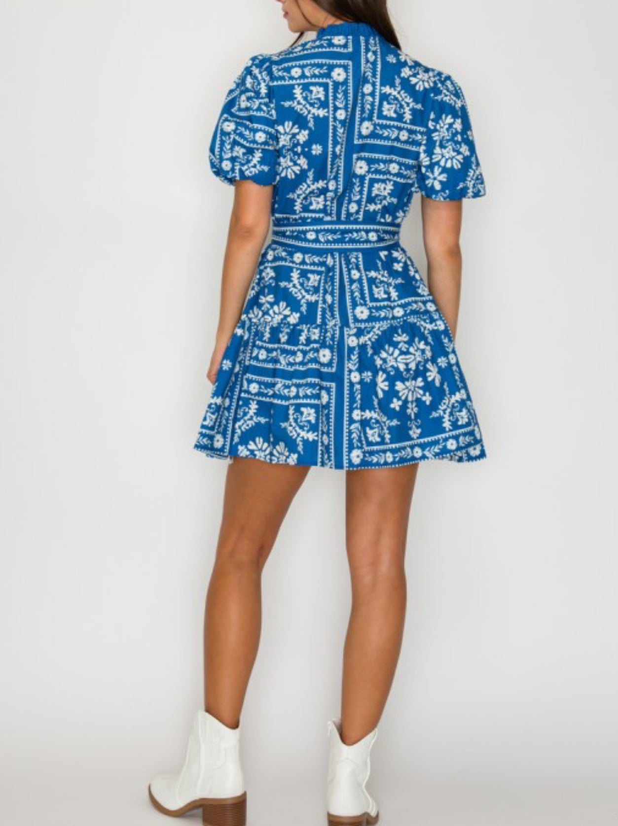 Back view of denim blue puff sleeve mini dress – perfect for game day or brunch.