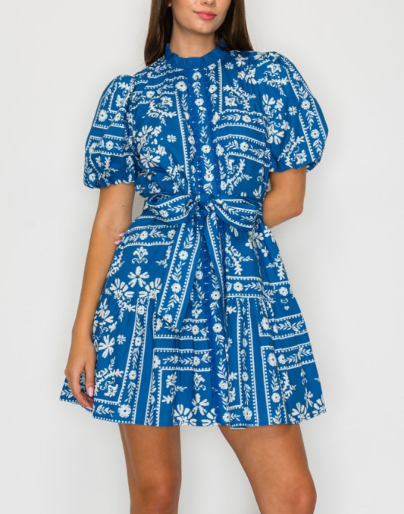 Front view of denim blue bandana print cotton mini dress with puff sleeves.
